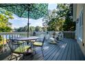Relaxing outdoor deck with seating and a lake view, perfect for entertaining or enjoying the scenery at 1187 Plantation Dr, Villa Rica, GA 30180