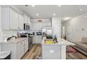 Well-equipped kitchen with stainless steel appliances, granite countertops, and gray cabinets at 1901 Creel Ln, Atlanta, GA 30349