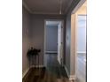The hallway features updated paint and flooring and offers seamless transition between rooms at 1290 Elizabeth Ave, Atlanta, GA 30310