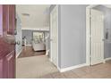 Inviting foyer with tile flooring leading to the living area with hardwood floors and an open floor plan at 411 Sureyya Dr, Canton, GA 30114
