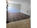 The living room has modern gray walls and wood flooring at 4701 Flat Shoals Rd, Union City, GA 30291