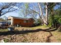 View of the property's rear exterior, showing a car port attached to the home at 3117 Janice Cir, Atlanta, GA 30341