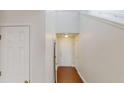 Bright hallway with white walls and hardwood floors leading to various rooms at 3515 Devon Chase Rd, Atlanta, GA 30349