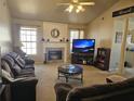 Inviting living room with a stone fireplace, vaulted ceilings, and comfortable seating at 68 Georgias Ln, Dallas, GA 30157