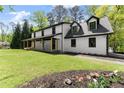 Stylish home with a covered front porch, charming details and a spacious yard at 110 Myers Dr, Alpharetta, GA 30009