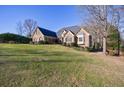 Lovely brick home with dark shutters and lush green lawn at 2667 White Rock Dr, Buford, GA 30519