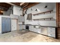 Modern kitchen features white cabinets, stainless steel appliances, and a large stainless steel sink at 644 Wells Sw St # 8, Atlanta, GA 30310