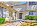 Charming townhouse with well-maintained landscaping and a covered entryway at 1124 Country Ct, Lawrenceville, GA 30044