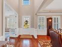 Elegant foyer with hardwood floors, tall ceilings, and decorative wainscoting at 4916 Locklear Way, Marietta, GA 30066