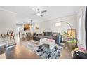 Spacious living room featuring hardwood floors, a modern ceiling fan, and ample natural light at 2113 Gorman Se Grv, Atlanta, GA 30316