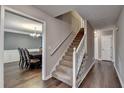 Carpeted staircase with wooden banister, leading to the upper level at 3253 Brookshire Way, Duluth, GA 30096