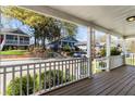 View from covered front porch, showcasing neighborhood homes at 900 Oakhill Sw Ave, Atlanta, GA 30310