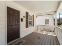 Covered front porch with welcome mat, and view of front door at 900 Oakhill Sw Ave, Atlanta, GA 30310