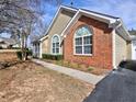 A well-maintained home with a brick facade, manicured lawn, and inviting curb appeal at 2730 Vintage Reserve Ln, Marietta, GA 30066