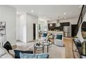 Bright, open living space with hardwood floors, comfortable seating, and a modern kitchen at 1792 Charles Nw Pl, Atlanta, GA 30318