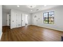 Bright living room with hardwood floors, fresh white paint, and modern trim work at 801 Arbor Hill Dr, Stone Mountain, GA 30088