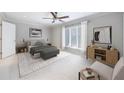 Serene main bedroom with natural light, neutral tones, and a ceiling fan at 13 Ivy Ne Sq, Atlanta, GA 30342