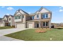 Charming brick home featuring a two car garage, neat landscaping, and a welcoming facade at 2781 Dolce Rd, Dacula, GA 30019