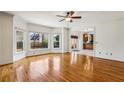 Bright and airy living room features hardwood floors, large windows, and neutral paint at 321 Covered Bridge Sw Pl, Smyrna, GA 30082