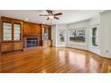Bright living room with hardwood floors, built-in cabinets, and a cozy fireplace at 321 Covered Bridge Sw Pl, Smyrna, GA 30082
