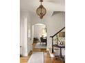 Elegant foyer featuring a staircase and light fixture leading to other rooms at 950 Clairemont Ave, Decatur, GA 30030