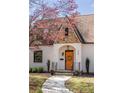 Close-up of the inviting front door with stone and brick accents on the home's exterior at 950 Clairemont Ave, Decatur, GA 30030