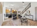 Bright open concept living area with modern finishes and a staircase leading to the upper level at 1800 Charles Nw Pl, Atlanta, GA 30318