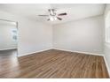 Bright, open living room with sleek flooring, neutral walls and a modern ceiling fan at 4062 Doster Sw Dr, Atlanta, GA 30331