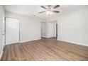 Open living space with wood-look flooring, neutral walls, and a ceiling fan for added comfort at 4062 Doster Sw Dr, Atlanta, GA 30331