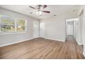 Comfortable living room with gleaming floors, neutral walls, and natural light from a large window at 4062 Doster Sw Dr, Atlanta, GA 30331