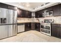 Beautiful kitchen features stainless steel appliances, modern cabinetry, and neutral tile backsplash at 795 Hammond 1013 Dr, Sandy Springs, GA 30328