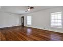 Spacious living room features hardwood floors, fresh white paint, and large windows at 3427 Springlake Dr, Decatur, GA 30032