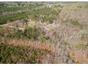 Scenic aerial view of the home nestled among lush trees and the surrounding landscape at 138 Rutledge Rd, Temple, GA 30179