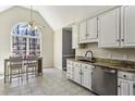 Eat-in kitchen with stainless steel appliances, granite countertops, and a large window at 5163 Holly Springs Dr, Douglasville, GA 30135