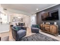 Open-concept living and dining area with sleek furnishings and modern decor at 240 Renaissance Ne Pkwy # 106, Atlanta, GA 30308