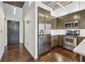 Modern kitchen with stainless steel appliances and olive green cabinets at 3235 Roswell Ne Rd # 421, Atlanta, GA 30305