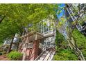 Charming townhome exterior with brick accents, white trim, and lush greenery at 1112 Park S Row, Atlanta, GA 30312