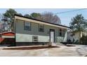Charming house with a tidy lawn and a long driveway at 6370 Boca Grande Blvd, Forest Park, GA 30297