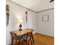 Dining area showcasing parquet floors, modern lighting, and unique wall art at 300 Peachtree Ne St # 18I, Atlanta, GA 30308
