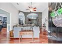 A welcoming living room featuring hardwood floors, stone arches, and an open floor plan at 12551 Alcovy Rd, Covington, GA 30014