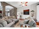 Comfortable living room with an entertainment center and hardwood floors at 12551 Alcovy Rd, Covington, GA 30014