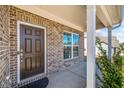 Close up of the front door and entryway area, highlighting the brick facade at 3505 Aqua Point Pl, Cumming, GA 30041