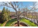 Expansive green lawn with walking paths and mature trees under a bright blue sky at 5910 Bond St # 401, Cumming, GA 30040