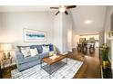 Comfortable living room with vaulted ceilings flowing into the dining area and kitchen at 2107 Penrose Dr, Atlanta, GA 30344