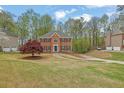 Classic two-story home with a brick facade, symmetrical design, and a well-maintained lawn at 4495 Sagebrush Nw Dr, Kennesaw, GA 30152
