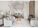 Bright living room with modern fireplace, and a view of the kitchen and dining area with an open floor plan at 1035 Walker Se Ave, Atlanta, GA 30316
