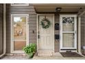 Charming entrance with decorative wreath, covered porch, and well-maintained exterior at 1088 Riverbend Club Se Dr, Atlanta, GA 30339