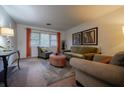 Inviting living room featuring neutral walls, patterned armchairs, a cozy ottoman, and warm lighting at 3668 Kingsboro Ne Rd # 6, Atlanta, GA 30319