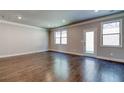 Spacious living room with hardwood floors, crown molding and access to the outdoors at 293 Depot Landing Rd, Auburn, GA 30011