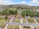 Aerial neighborhood view showing the property surrounded by mature trees at 3920 Cain Mill Dr, Lithonia, GA 30038